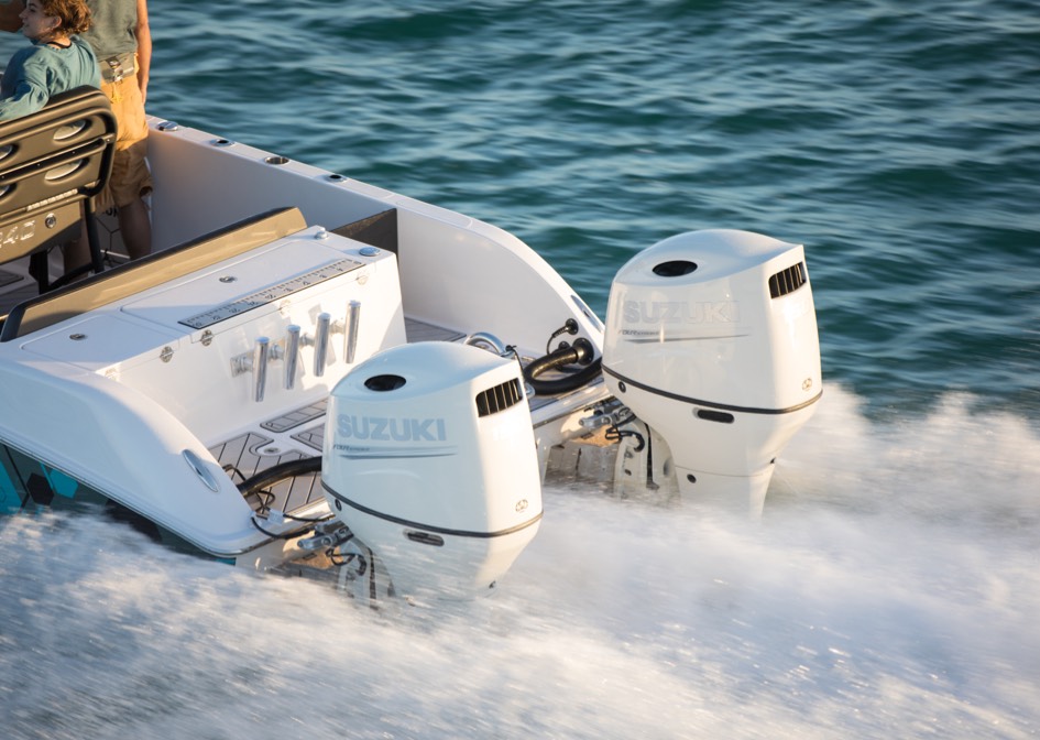 white suzuki outboard anchored in a small boat
