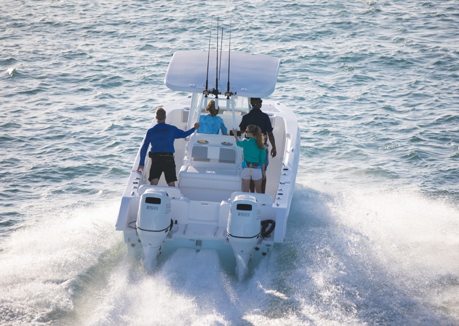 suzuki compact outboards anchored in a white small boat ideal for general water activities