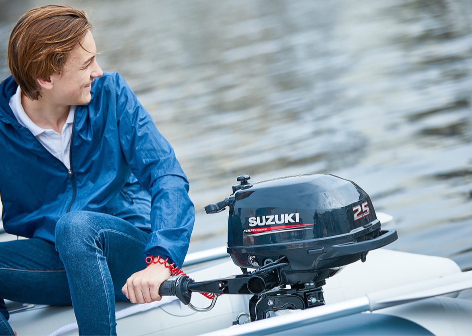 suzuki outboard anchored on a small white boat